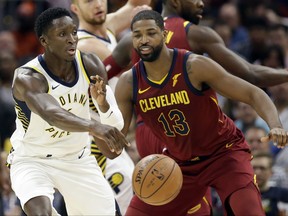 Indiana Pacers' Victor Oladipo (4) passes against Cleveland Cavaliers' Tristan Thompson (13) in the first half of an NBA basketball game, Wednesday, Nov. 1, 2017, in Cleveland. (AP Photo/Tony Dejak)
