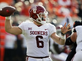 Oklahoma quarterback Baker Mayfield (6) throws in the first half of an NCAA college football game against Oklahoma State in Stillwater, Okla., Saturday, Nov. 4, 2017. (AP Photo/Sue Ogrocki)