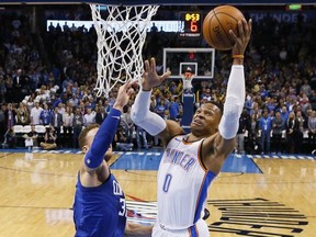 Oklahoma City Thunder guard Russell Westbrook, left, shoots in front of Los Angeles Clippers forward Blake Griffin (32) in the first quarter of an NBA basketball game in Oklahoma City, Friday, Nov. 10, 2017. (AP Photo/Sue Ogrocki)