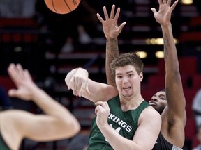 Portland State center Ryan Edwards, left, passes the ball away from Butler forward Tyler Wideman during the first half of an NCAA college basketball game during the Phil Knight Invitational tournament in Portland, Ore., Friday, Nov. 24, 2017. (AP Photo/Craig Mitchelldyer)