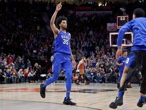 Duke forward Marvin Bagley III reacts at the end of overtime of an NCAA college basketball game against Texas in the Phil Knight Invitational tournament in Portland, Ore., Friday, Nov. 24, 2017. Duke won 85-78. (AP Photo/Craig Mitchelldyer)