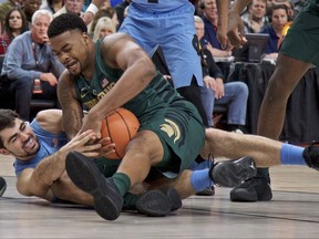 Michigan State forward Nick Ward, right, and North Carolina forward Luke Maye scramble for a loose ball during the first half of an NCAA college basketball game in the Phil Knight Invitational tournament in Portland, Ore., Sunday, Nov. 26, 2017. (AP Photo/Craig Mitchelldyer)