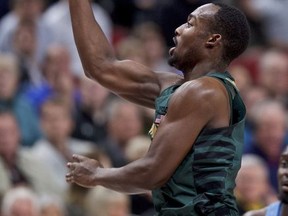 Michigan State guard Joshua Langford, right, shoots over North Carolina guard Kenny Williams during the first half of an NCAA college basketball game in the Phil Knight Invitational tournament in Portland, Ore., Sunday, Nov. 26, 2017. (AP Photo/Craig Mitchelldyer)