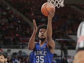 Duke's Marvin Bagley, III (35) gets past a Portland State defender for two points during the first half of an NCAA basketball game during the Phil Knight Invitation tournament in Portland, Ore., Thursday, Nov. 23, 2017. (AP Photo/Timothy J. Gonzalez)