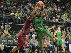 Oregon's Ruthy Hebard gets to the basket past Oklahoma's Vionise Pierre-Louis, left, in the second half of an NCAA college basketball game during the Phil Knight Invitational tournament in Eugene, Ore., Saturday, Nov. 25, 2017. (AP Photo/Timothy J. Gonzalez)