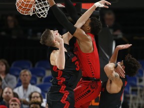 Gonzaga's Killian Tillie, left, can't stop Ohio State's Musa Jallow from dunking during the first half of an NCAA college basketball game during the Phil Knight Invitational tournament in Portland, Ore., Thursday, Nov. 23, 2017. (AP Photo/Timothy J. Gonzalez)