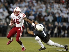 Nebraska's De'Mornay Pierson-El (15) stiff arms Penn State's Christian Campbell (1) after a catch during the first half of an NCAA college football game in State College, Pa., Saturday, Nov.18, 2017. (AP Photo/Chris Knight)