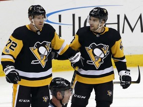 Pittsburgh Penguins' Patric Hornqvist (72) celebrates his goal with Conor Sheary (43) in the first period of an NHL hockey game against the Buffalo Sabres in Pittsburgh, Tuesday, Nov. 14, 2017. (AP Photo/Gene J. Puskar)
