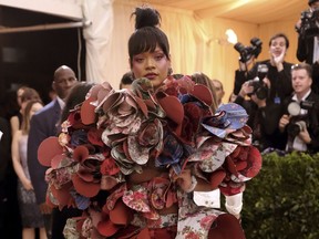 FILE - In this May 1, 2017, file photo, Rihanna attends The Metropolitan Museum of Art's Costume Institute benefit gala celebrating the opening of the Rei Kawakubo/Comme des Garçons: Art of the In-Between exhibition in New York. The Met announced on Nov. 8, 2017, that Rihanna, Amal Clooney, Donatella Versace and Anna Wintour will serve as co-chairs of next year's event. (Photo by Charles Sykes/Invision/AP, File)