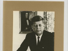 This undated image provided by Nathan Raab, president of rare documents dealer The Raab Collection in Ardmore, Pa., shows an autographed photo that U.S. ambassador Thomas Estes received from President John F. Kennedy when Estes met with the president on Nov. 21, 1963, the day before Kennedy's assassination. The rare documents dealer was offering the autographed photo for purchase in November 2017 with an asking price of $80,000. The inscription reads: "To Ambassador Estes. With esteem and very warm regards. John F. Kennedy." (Nathan Raab/The Raab Collection via AP)