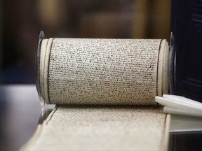 The original manuscript of "The 120 Days of Sodom, or the School of Libertinage," a scandalous and pornographic novel written by French writer Marquis de Sade while jailed in the Bastille prison is displayed prior to the auction of the Aristophil Collections, in Neuilly-sur-Seine, west of Paris, Tuesday, Nov. 14, 2017. Thousands of French private investors, victims of a vast pyramid scheme, hope to get some of their stake back when a huge collection of rare and valuable manuscripts begin to be auctioned in Paris next month by court order. (AP Photo/Thibault Camus)