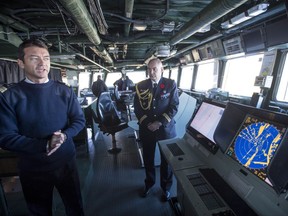 Thomas Fraioli, ship captain of the FS Forbin, stands on its bridge Friday, November 10, 2017 in Montreal. The French frigate is in Montreal for several days, partly for Remembrance Day activities. THE CANADIAN PRESS/Paul Chiasson