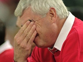 FILE - In this Nov. 23, 1995, file photo, Indiana coach Bobby Knight has a hard time watching the action as University of Alaska-Anchorage pulls ahead of his team during their Great Alaska Shootout game in Anchorage, Alaska. Shootout fans over the years witnessed the best of college basketball, with Duke, North Carolina, Kentucky, Michigan State and UCLA winning titles, but the end is near. The 40th Shootout will be the last, a victim of changed rules and competition. (AP Photo/Jack Smith, file)