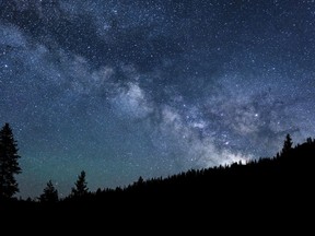 This June 18, 2017, photo provided by Nils Ribi Photography shows the Milky Way over the Smoky Mountains near Ketchum, Idaho. The International Dark-Sky Association on Tuesday, Oct. 31 designated the central Idaho city of Ketchum an International Dark Sky Community, only the 16th in the world. (Nils Ribi Photography via AP)