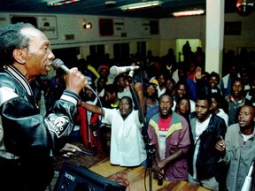 FILE - In this May 6, 2000 photo, Zimbabwean music star Thomas Mapfumo performs in Chitungwiza, south of Harare, Zimbabwe. One of Zimbabwe's most famous music stars, Mapfumo, sees little hope for change in his country despite the ouster of longtime dictator Robert Mugabe. TMapfumo has been in exile from his country in Eugene, Ore., since 2004 and has watched the euphoria over Mugabe's downfall with skepticism.  (AP Photo/Schalk van Zuydam, File)