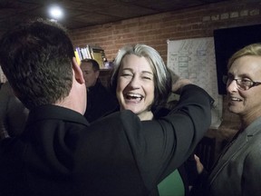 PC Leader James Aylward, left, embraces Green Party candidate, and by-election winner, Hannah Bell in Charlottetown on Monday, November 27, 2017.
