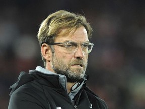 Liverpool manager Juergen Klopp grimaces prior the Champions League Group E soccer match between Liverpool and Maribor at Anfield, Liverpool, England, Wednesday Nov. 1, 2017. (AP Photo/Rui Vieira)