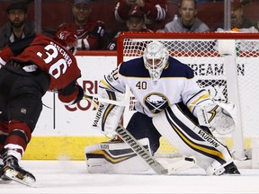 Arizona Coyotes right wing Christian Fischer (36) has his shot blocked by Buffalo Sabres goalie Robin Lehner (40) during the first period of an NHL hockey game Thursday, Nov. 2, 2017, in Glendale, Ariz. (AP Photo/Ross D. Franklin)