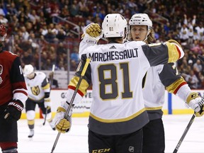 Vegas Golden Knights forwards William Karlsson (right) and Jonathan Marchessault celebrate a goal against the Arizona Coyotes on Nov. 25.