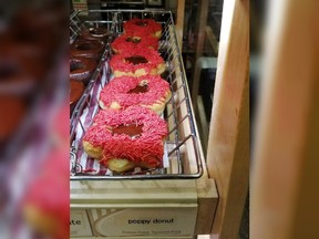 A poppy donut is seen at a Tim Hortons in Calgary. The head of the Calgary Poppy Fund and Veterans' Food Bank says he hopes no one gets in big trouble over a poppy-emblazoned doughnut sold at a local Tim Hortons.