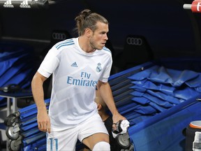 FILE - In this Aug. 23, 2017 file photo, Real Madrid's Gareth Bale steps from the tunnel onto the pitch at the Santiago Bernabeu stadium in Madrid, Spain. Bale is expected to make his return to Real Madrid's lineup in a Copa del Rey match against Fuenlabrada on Tuesday Nov. 28, 2017 after being sidelined for more than two months because of injuries. (AP Photo/Paul White, File)