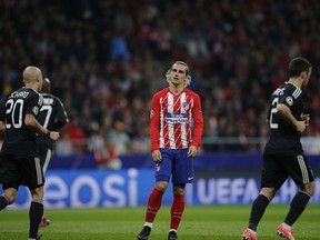 Atletico's Antoine Griezmann reacts after missing a free kick during a Group C Champions League soccer match between Atletico Madrid and Qarabag at the Metropolitano stadium in Madrid, Spain, Tuesday, Oct. 31, 2017. (AP Photo/Paul White)