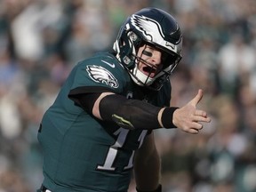 Philadelphia Eagles' Carson Wentz reacts after running for a first down during the first half of an NFL football game against the Chicago Bears, Sunday, Nov. 26, 2017, in Philadelphia. (AP Photo/Michael Perez)