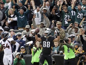 Philadelphia Eagles' Trey Burton (88) celebrates after scoring a touchdown past Denver Broncos' Brandon Marshall (54) during the first half of an NFL football game Sunday, Nov. 5, 2017, in Philadelphia. (AP Photo/Matt Rourke)