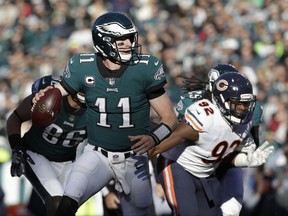 Philadelphia Eagles' Carson Wentz looks to pass during the first half of an NFL football game against the Chicago Bears, Sunday, Nov. 26, 2017, in Philadelphia. (AP Photo/Michael Perez)