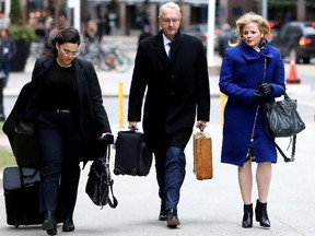 Laura Miller, right, deputy chief of staff to former Ontario premier Dalton McGuinty, arrives with her lawyer Scott Hutchison for closing arguments at court in Toronto on Wednesday, Nov. 22, 2017. Miller and her boss, David Livingston, are accused of illegally destroyed documents related to the government’s decision to cancel two gas plants in 2011.