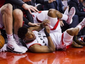 Toronto Raptors' Kyle Lowry hits the floor while going for a loose ball during NBA action Wednesday night at the ACC. Lowry had 36 points as the Raptors posted a 126-113 victory.