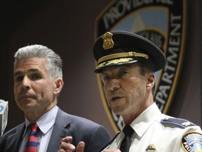 Providence Police Chief Hugh Clements speaks during a press conference to discuss the shooting which resulted in the death of Joseph J. Santos, Friday, Nov. 10, 2017 in Providence, R.I.. At left is Steven M. Pare, Commissioner of Public Safety. Providence Police held a press conference to show highway surveillance footage of the moments leading up the shooting and video from an officer's body camera of the shooting, which does contain profanity. They said they believe the footage shows an imminent danger to the public, justifying use of force. (Bob Breidenbach/Providence Journal via AP)
