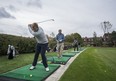 Rod O’Hara and his son Sean use the practice facilities at Credit Valley Golf and Country Club