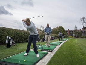 Rod O’Hara and his son Sean use the practice facilities at Credit Valley Golf and Country Club