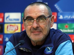 FILE - In this Monday, Nov. 20, 2017 file photo, Napoli's coach Maurizio Sarri attends a press conference at Castelvorturno Sport Center in Naples, Italy. Maurizio Sarri seems like a throwback to another era of football coaches but his vision of the game is at the sport's vanguard. If Serie A leader Napoli is going to win its first title in nearly three decades, a large part of the squad's success will be attributed to a manager who is the ultimate anti-establishment character. Not since Arrigo Sacchi arrived at AC Milan 30 years ago has Italian soccer seen a coach so revolutionary, someone willing to attack relentlessly with free-flowing ball movement and constant running that appears like an evolution of Pep Guardiola's tactics. (Cesare Abbate/ANSA via AP, File)