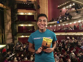 This Oct. 4, 2017 photo taken by Megan Rohrer shows Mauricio Gonzalez posing for a photo at THE CIBC Theatre in Chicago while attending the performance "Hamilton: An American Musical" in downtown Chicago. Gonzalez was among the approximately 2,000 first year students at Northwestern University who got to see the show for free as part of the school's "One Book One Northwestern" program. It's one of the ways colleges are using the hugely popular musical to teach students about history, art, critical thinking, performance, culture, and even politics. (Megan Rohrer via AP)