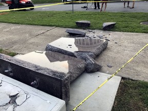 FILE - In this June 28, 2017, file photo, a Ten Commandments monument outside the state Capitol in Little Rock, Ark., is blocked off after Michael Tate Reed crashed into it with a vehicle, less than 24 hours after the privately funded monument was installed on the Capitol grounds. A Pulaski County judge on Thursday, Nov. 16, 2017, found Reed unfit to proceed and ordered him to be held by the state hospital for further evaluation. Judge Chris Piazza set a September 2018 hearing on Reed's mental status. (AP Photo/Jill Zeman Bleed, File)