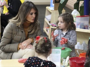 First lady Melania Trump watches as children form objects from Play-Doh at Joint Base Elmendorf-Richardson, Alaska, on Friday, Nov. 10, 2017. Trump visited with children taking part in programs for the children of military members at the base in Anchorage, Alaska, before flying back to Washington, D.C. (AP Photo/Mark Thiessen)