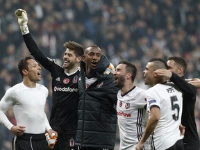 From left, Besiktas' Adriano, goalkeeper Fabri, Talisca, Gokhan Gonul and Pepe celebrate after the Champions League Group G soccer match between Besiktas Istanbul and FC Porto in Istanbul, Turkey, Tuesday, Nov. 21, 2017. (AP Photo/Lefteris Pitarakis)