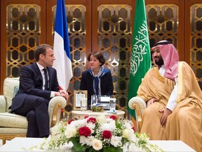 In this Nov. 9, 2017 photo, Saudi Crown Prince Mohammed bin Salman, right, meets with French President Emmanuel Macron upon his arrival in Riyadh, Saudi Arabia.