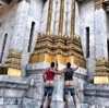 Two Americans were arrested in Bangkok for exposing themselves in front of a Buddhist temple.