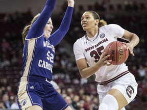 South Carolina forward Alexis Jennings (35) drives to the basket against Western Carolina forward Emily Hatfield (52) during the first half of an NCAA college basketball game Thursday, Nov. 30, 2017, in Columbia, S.C. (AP Photo/Sean Rayford)