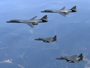 U.S. Air Force B-1B bombers and South Korean fighter jets fly over the Korean Peninsula on June 20, 2017.