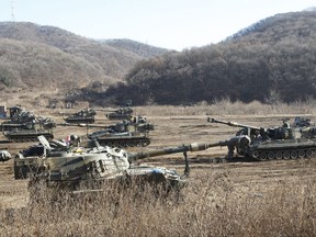 South Korean army's K-55 self-propelled howitzers take positions during a military exercises in Paju, South Korea, near the border with North Korea, Wednesday, Nov. 29, 2017. After 2 ½ months of relative peace, North Korea launched its most powerful weapon yet early Wednesday, a presumed intercontinental ballistic missile that could put Washington and the entire eastern U.S. seaboard within range. (AP Photo/Ahn Young-joon)