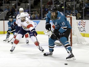 San Jose Sharks' Joe Thornton (19) controls the puck in front of Florida Panthers' Aaron Ekblad (5) during the first period of an NHL hockey game Thursday, Nov. 16, 2017, in San Jose, Calif. (AP Photo/Marcio Jose Sanchez)