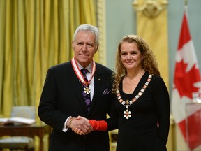 Julie Payette, Governor General of Canada, presents the insignia of the Order of Canada to Alex Trebek at Rideau Hall in Ottawa on Friday Nov. 17, 2017. THE CANADIAN PRESS/Sean Kilpatrick