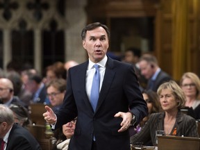 Finance Minister Bill Morneau stands during question period in the House of Commons on Parliament Hill in Ottawa on Monday, Nov. 27, 2017. THE CANADIAN PRESS/Sean Kilpatrick