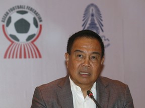 Football Association of Thailand President Somyot Poompanmuang talks to reporters during a press conference in Bangkok, Thailand, Tuesday, Nov. 21, 2017.  Somyot said five players and two match officials from the top-flight national league are among the 12 people arrested for alleged match fixing. (AP Photo/Sakchai Lalit)