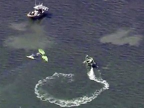 Authorities investigate a small plane crash in the Gulf of Mexico, near Holiday, Fla. on Tuesday, Nov. 7, 2017.