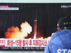 A man watches a TV screen showing what the North Korean government calls the Hwasong-15 intercontinental ballistic missile, at the Seoul Railway Station in Seoul, South Korea, Thursday, Nov. 30, 2017.